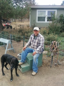 Jerry with Sam the dog at the ranch. Sam had just rolled in yak poop.