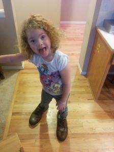 My niece Lily's cuteness continues to flourish. Here she is in her dad's size 15 shoes.